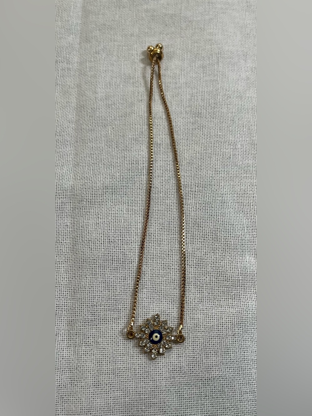 Gold Tone & Crystal Evil Eye Pendant Bracelet.